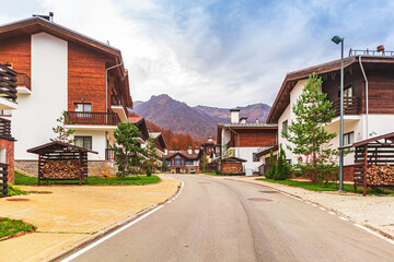 Traditional chalet houses and hotels in Rosa Khutor resort. Mountain Olympic village in the Caucasus Mountains.