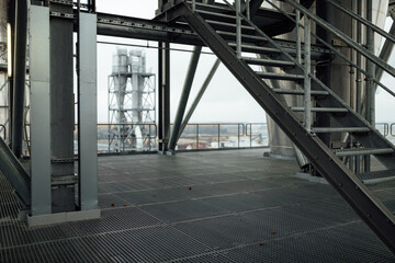 view of the factory pipes and workshops. working industrial production. harmful emissions of gases from pipes. metallurgical plant. communications and production lines