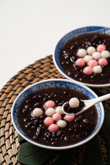 Red and white tangyuan with red bean soup.
