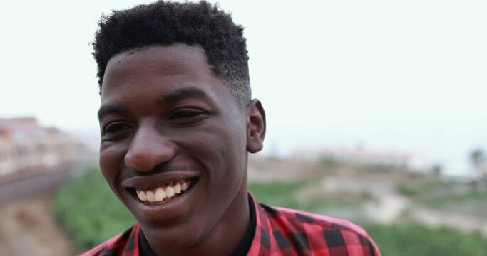 Young african man smiling on camera 