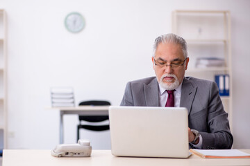 Old male employee and too much work in the office