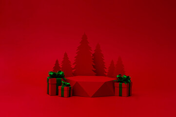 Christmas tree with red pedestal and red gift box with green ribbon on the red background. Christmas creative concept. Paper craft. Place for text.