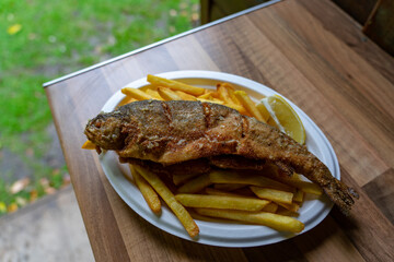 deep fried trout pisztrang fish traditional food in Szalajka valley Hungary
