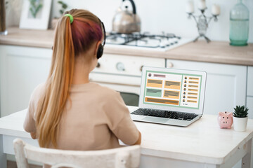 Girl student e-learning distance training course, study at home on laptop