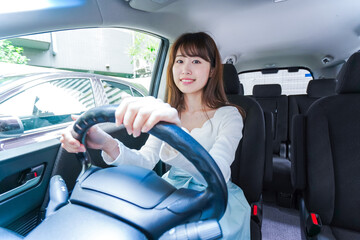 Young woman driving a car
