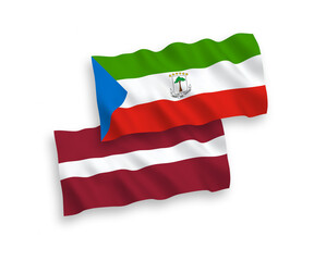 National vector fabric wave flags of Latvia and Republic of Equatorial Guinea isolated on white background. 1 to 2 proportion.