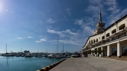 The seaport in the city of Sochi during the vacation of tourists on a warm summer day, view from...