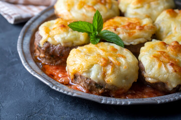 Turkish Food Hasanpasa Kofte - Kofta with Puree - Meatball with Bechamel Sauce and Green Peas. Traditional Food.