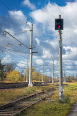 red signal semaphore on the railroad, train is coming, traffic light is red light, stop signal for...