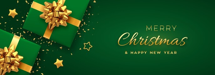 Fototapeta na wymiar Christmas banner. Realistic green gift boxes with golden bow, gold stars and glitter confetti. Xmas background, horizontal christmas poster, greeting cards, headers website. Vector illustration.