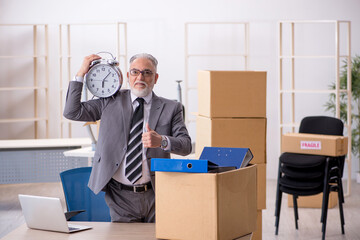 Old male employee in relocation concept