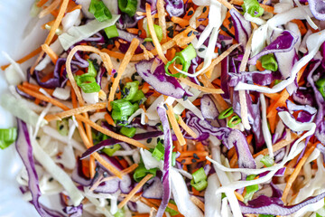 Vegetable background close-up, banner. Red cabbage and carrot vegetable salad, coleslow salad