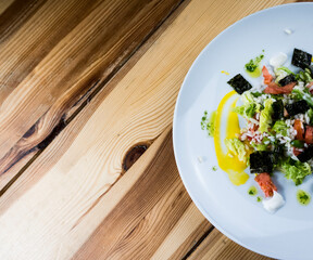 Delicious rice salad with lettuce, tomato, escarole and seaweed. Gourmet salad with natural products.