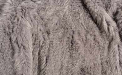 graues Kaninchenfell als Hintergrund