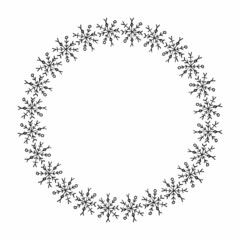 Round frame with handdrawn black snowflakes on white background. Vector image.