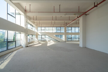 Undecorated interior space of office building - obrazy, fototapety, plakaty