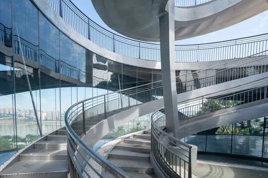 Geometric building structure of metal rotating stairs - Powered by Adobe