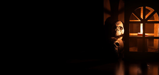 soft focus human skull in vintage lantern candle lights, dark Gothic style decoration with...
