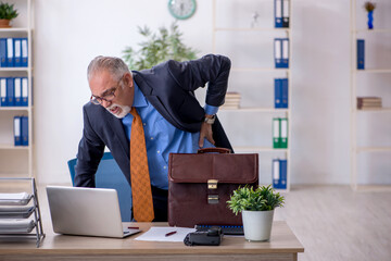 Old boss working in the office