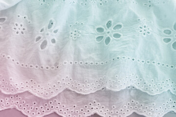 Background of white embroidered delicate lace fabric. pastel toned