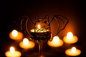 Fototapeta na wymiar Halloween bat candlestick in the dark