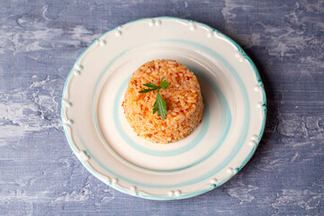 Traditional delicious Turkish food; rice pilaf with tomatoes (Turkish name; Domatesli pirinc pilavi)