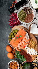 Assortment of omega 3 best sources on dark background.