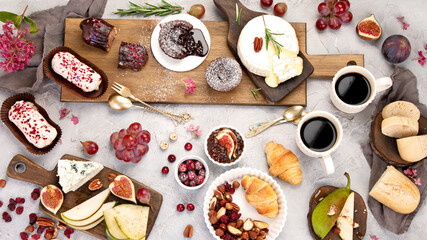 French desserts assortment on gray background.