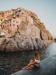 young woman in Manarola Cinque Terre Italy tourist exploring Manarola