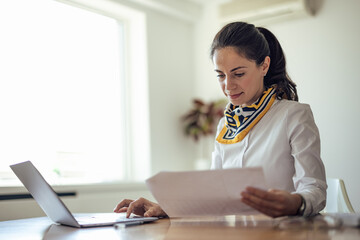 Adult woman, making sure her bank account is working.