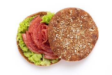 Sandwich with salami sausage on white background.