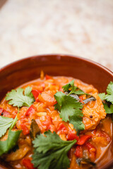 vegan food stew coriander cumin seeds oyster mushrooms onions and vegetables closeup