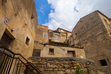 City landscape of old Sicilian Modica city. Sandstone houses, stairway and balconies, courtyards...