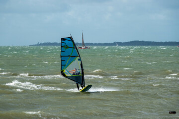 windsurfer in action with the Isle of Wight Hampshire England in the background