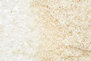 Polished long-grain rice on a white background.