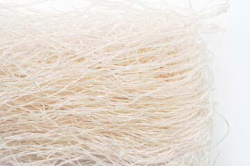 Asian thin rice noodles in close-up.