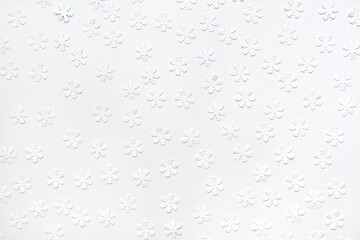 Christmas pattern of paper snowflakes on white background.