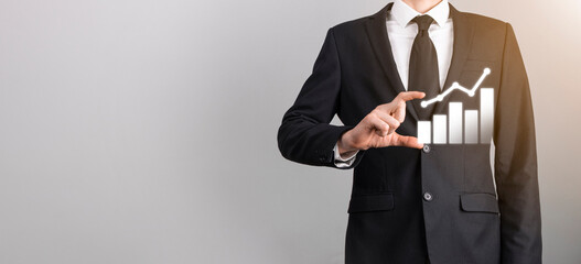 Male hand holding graph icon neon.checking analyzing sales data growth graph chart and stock market on global networking. Business strategy, planning and digital marketing