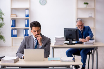 Two male colleagues working in the office