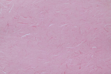 ピンク色の和紙テクスチャー背景