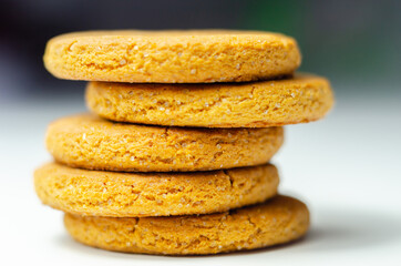 Close up on a stack of cinnamon oat cookies on a white background