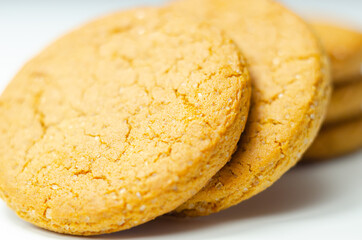 Close up on a stack of cinnamon oat cookies on a white background