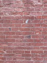 Brick red wall. Background of a old brick house.