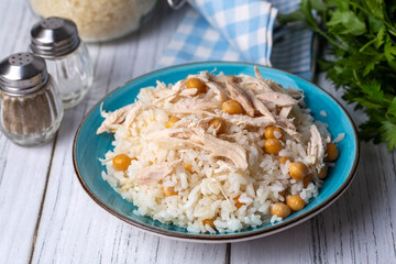 Traditional delicious Turkish food; Rice with chickpeas and chicken (Turkish name; Tavuklu nohutlu pilav or pilaf)