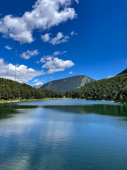 Engolasters lake in the Pyrenees, Andorra, sunny day, space for text, vertical photo
