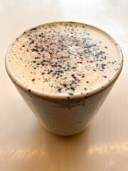 Brown coffee mug on the table.