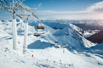 Sunny winter day in skiing area. Location place famous ski resort Ischgl/Samnaun. - obrazy, fototapety, plakaty