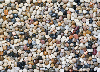 Multifunctional natural background from colorful pebbles. Home decoration. Abstract wallpaper. Outdoor landscape.