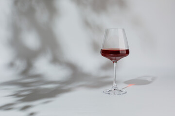 Red wine in a glass isolated on white background, copy space