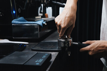person working on a machine coffee